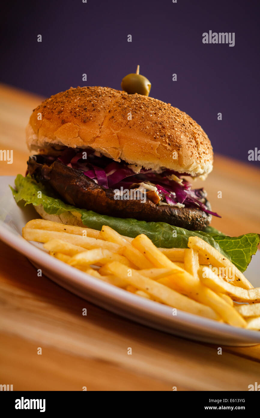 Multigrain bun vegan Portobello Burger plate with fries Stock Photo Alamy