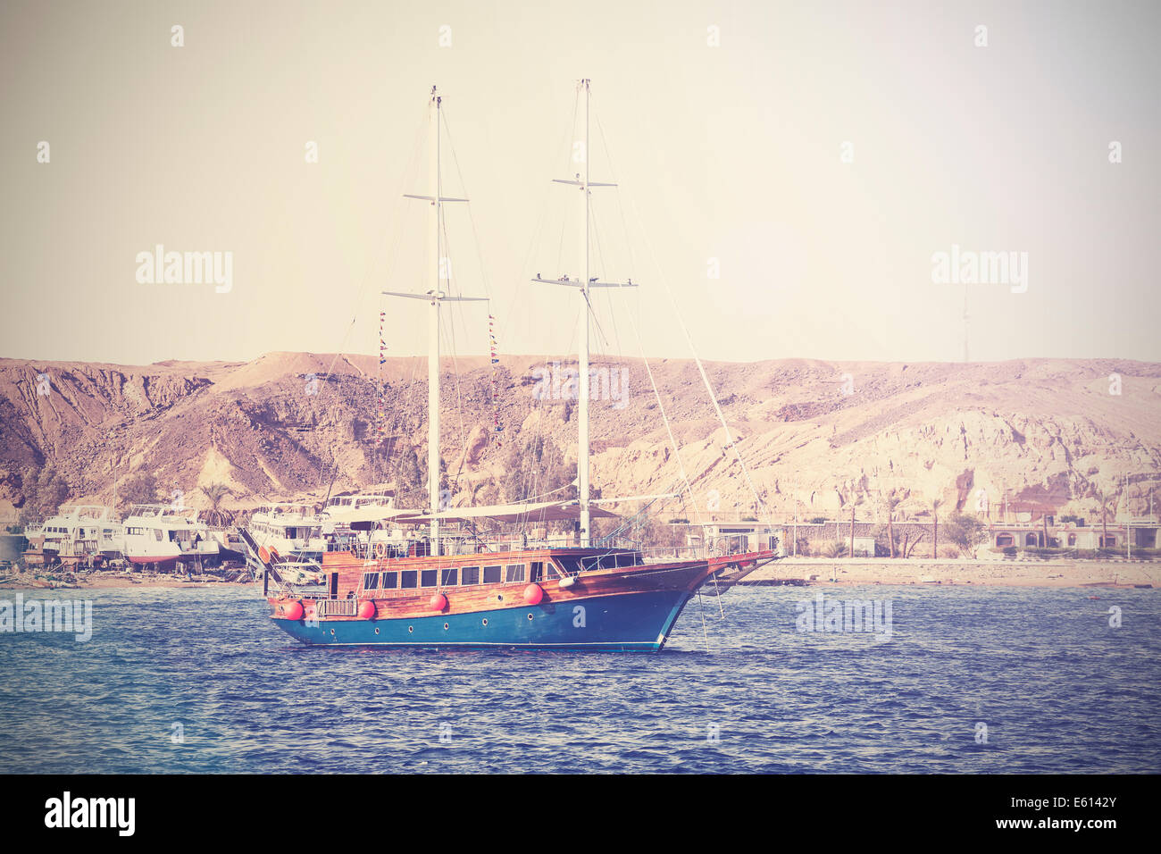 Vintage picture of a sailing boat on the sea in Egypt. Stock Photo