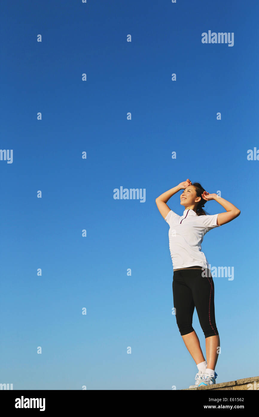Young Japanese girl stretching Stock Photo - Alamy