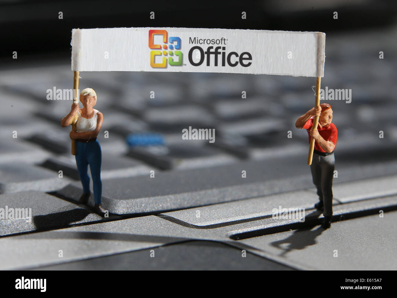 Illustration Miniature Figures Stand On The Keyboard Of A
