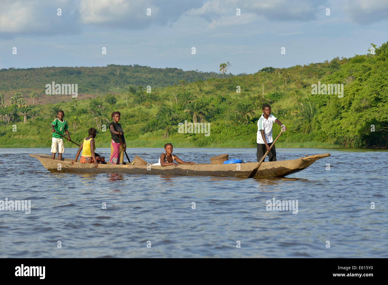 Fisher family on a pirogue on the Congo River, near Tshumbiri, Bandundu Province, Democratic Republic of the Congo Stock Photo