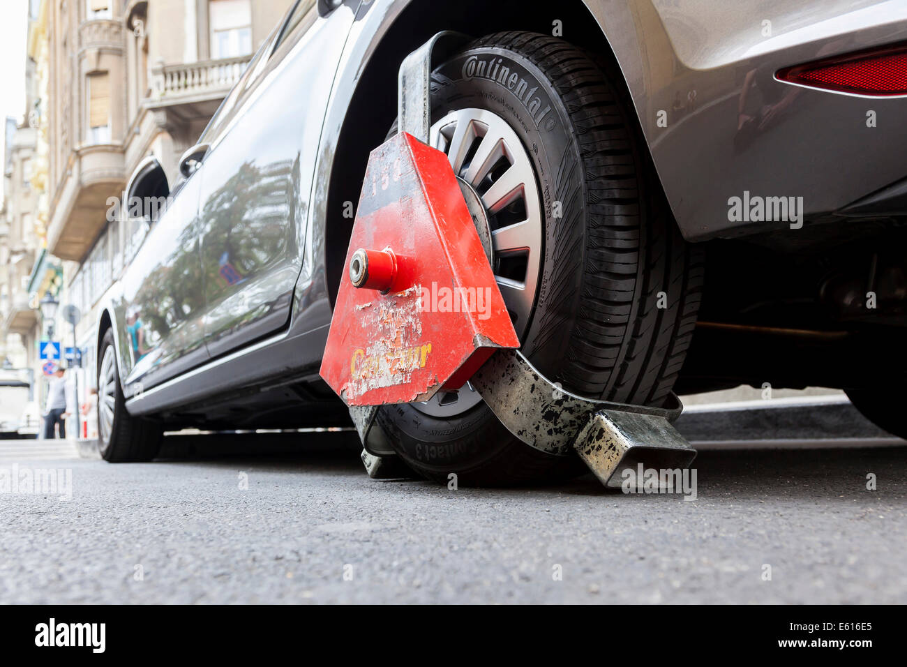 Wheel clamp on a vehicle, Budapest, Hungary Stock Photo
