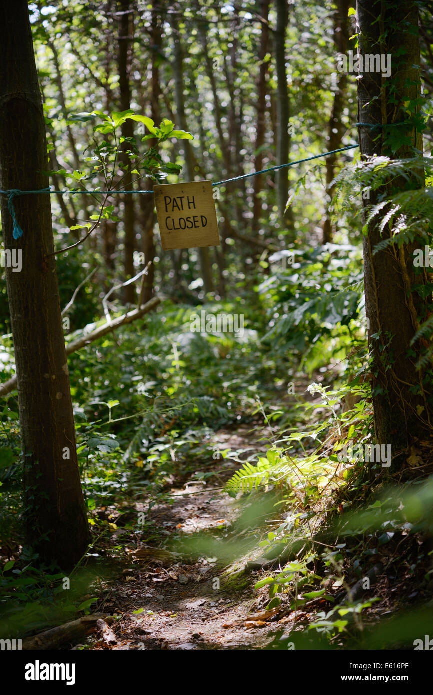 Path Closed sign in woodland, Wales, UK. Stock Photo