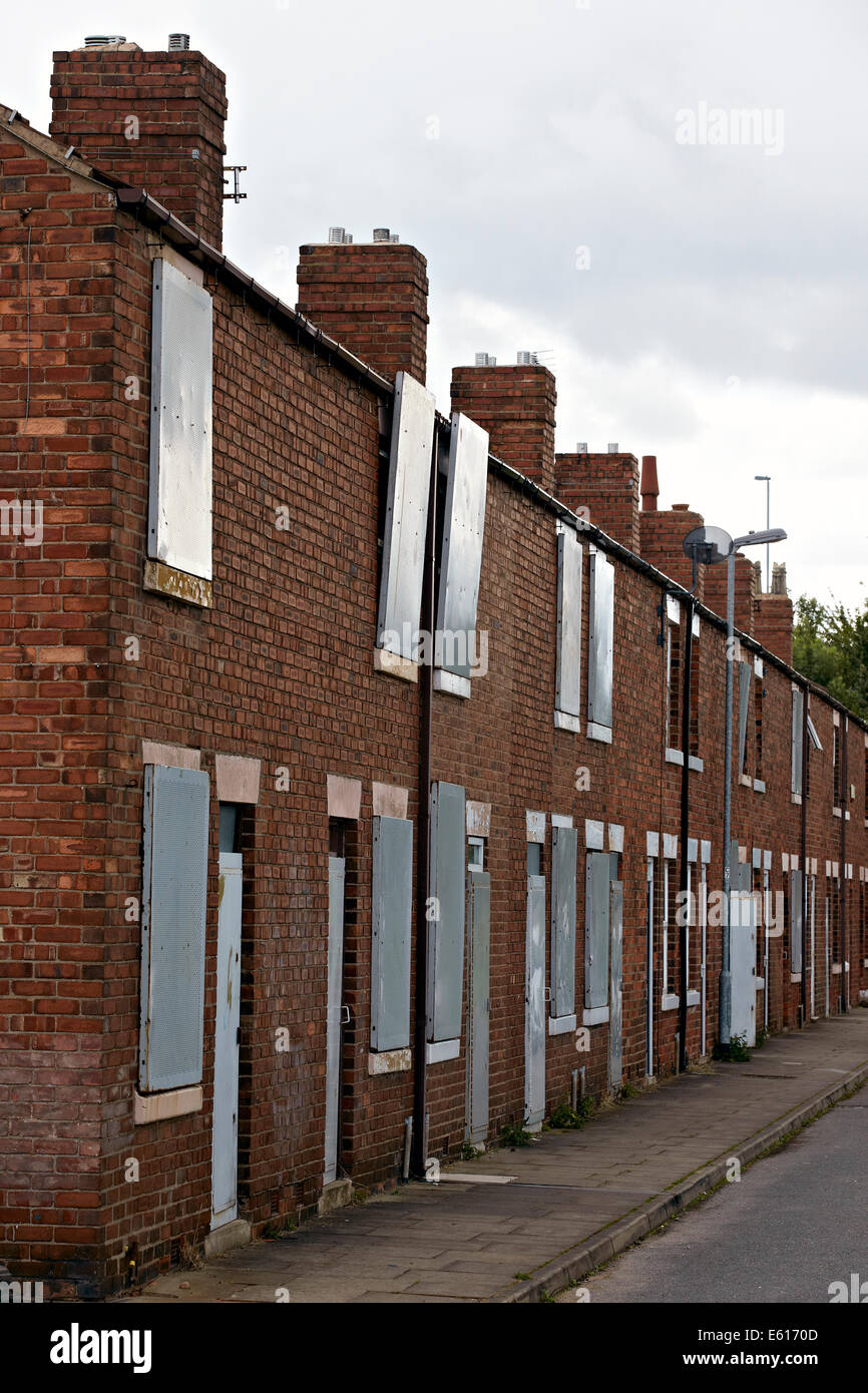 Boarded up empty Victorian terraced houses near Doncaster, UK. Housing stock can be refurbished so they are fit to live in. Stock Photo