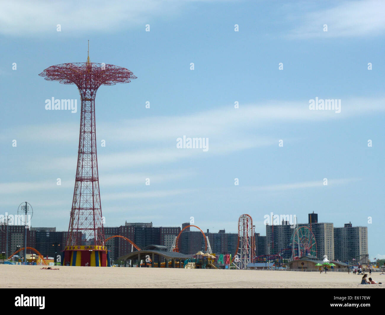 The Parachute Jump (L) and other fairground rides stand at the promenade of Brighton Beach on Coney Island, New York, USA, 24 June 2014. The Parachute Jump is an 80 meters high red steel tower weighing 150 tons. Originally it was part of the New York World Exhibition 1939 in the Flushing Meadows Park and was brought here by the operators of the Steeplechase Park wher it was used until 1968. Since July 1977 the tower is one of the city's landmarks and is under monumental protection since 1989. Photo: Alexandra Schuler - ATTENTION! NO WIRE SERVICE - Stock Photo