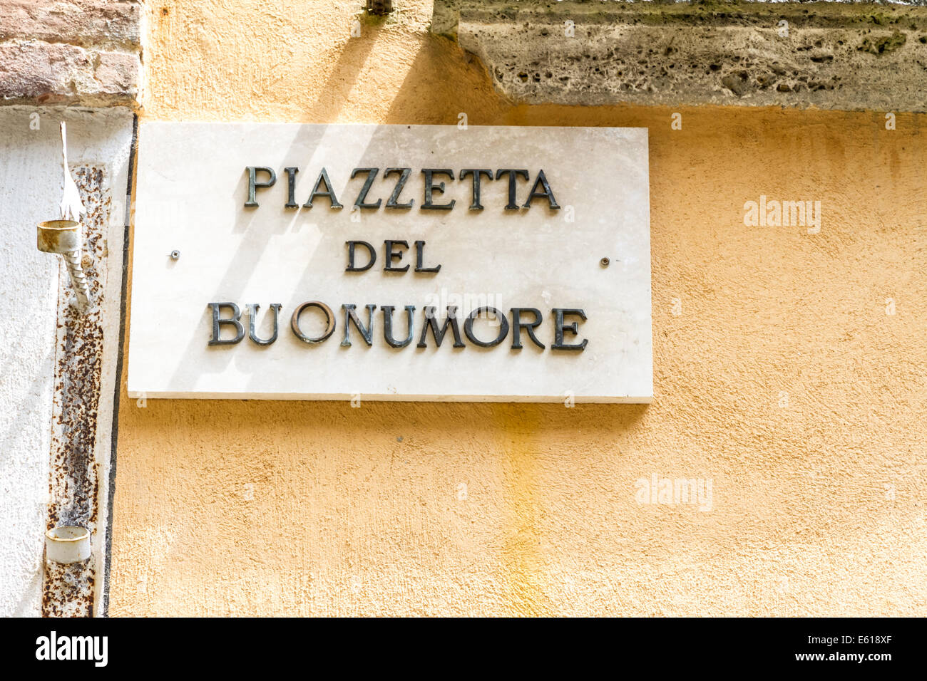 'Piazzetta del buonumore' means 'good mood place' in Italian. Road sign in Montepulciano, Tuscany Stock Photo