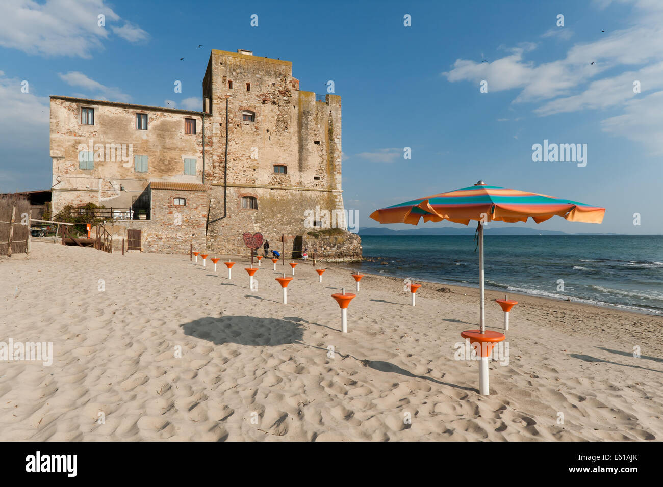 Torre Mozza is a 16th century Tuscan coastal tower, now a renowed 'blue flag' beach in Tuscany, Italy Stock Photo