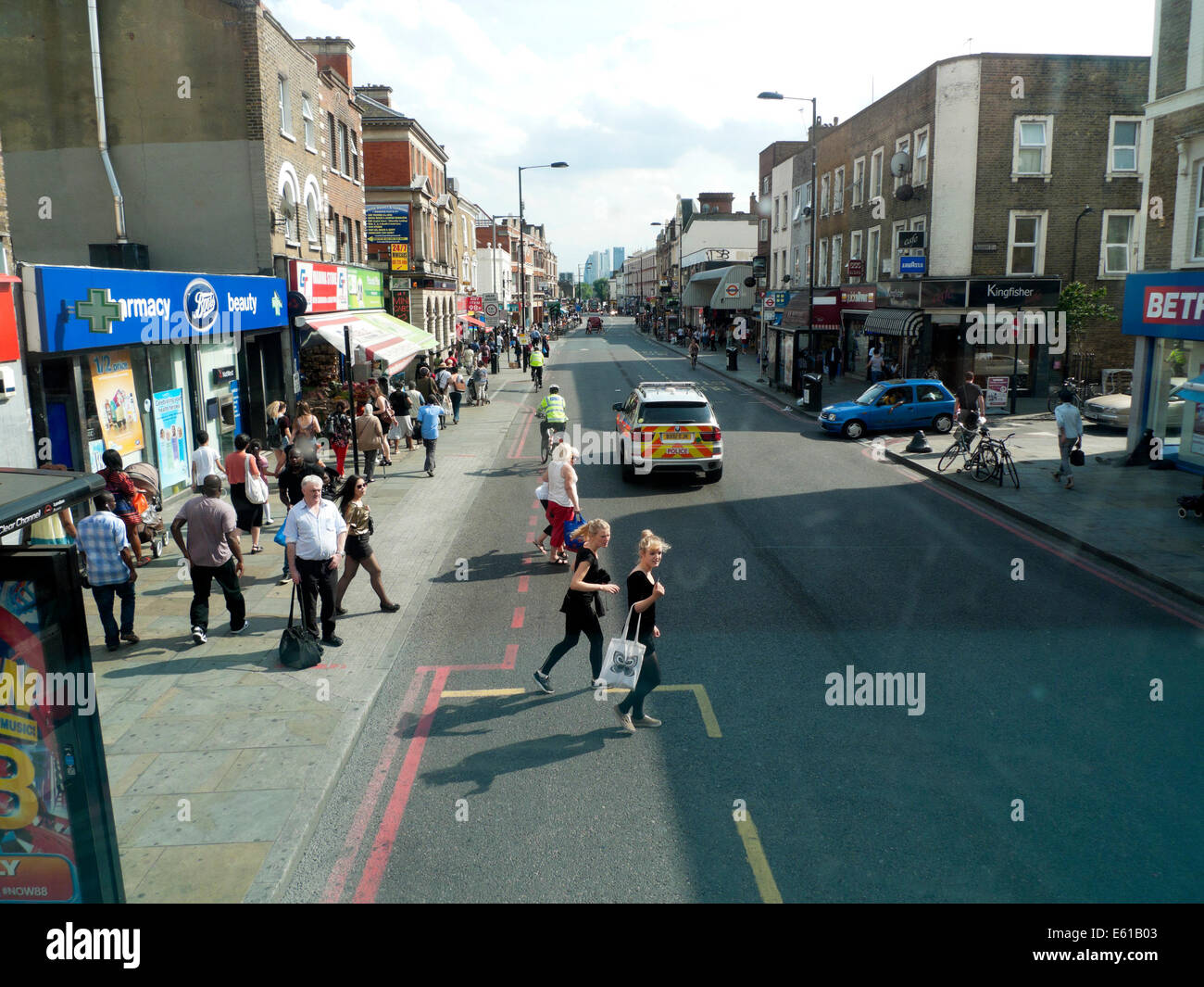 View of Kingsland Road high street & police car looking towards Central