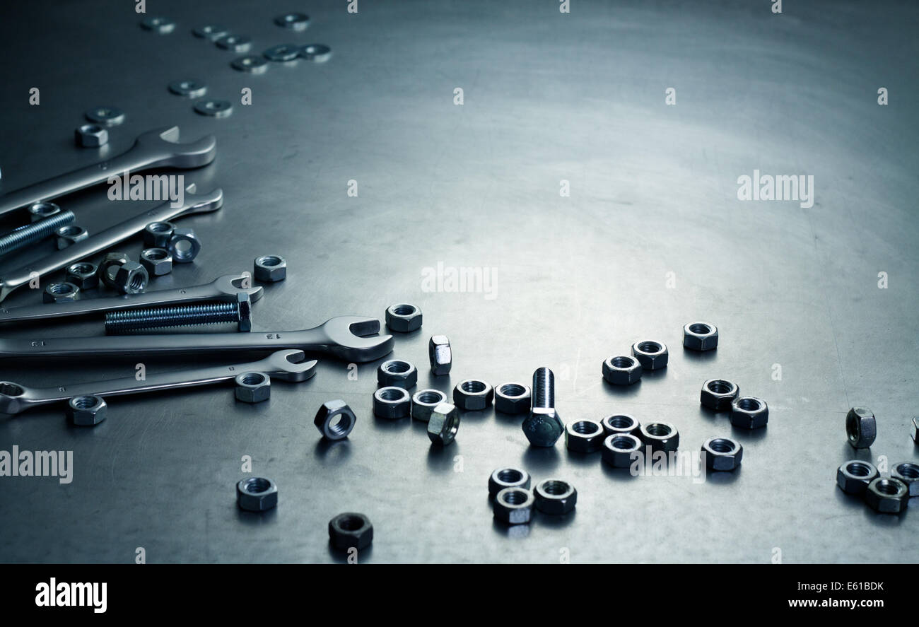 Wrenches, nuts and screws on a metal plate Stock Photo Alamy