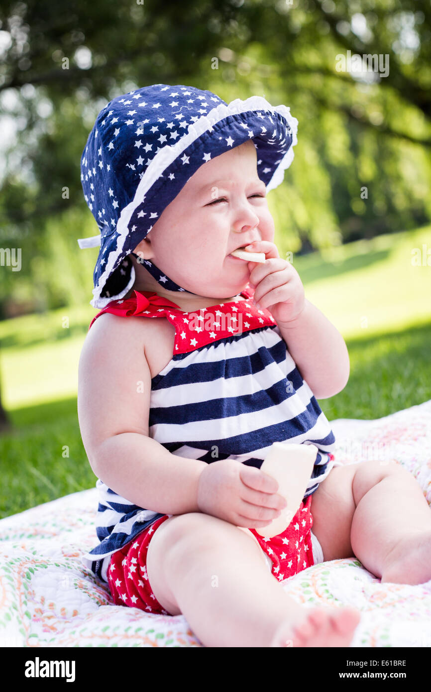 Cute baby girl celebrating 4th of July in the park Stock Photo Alamy