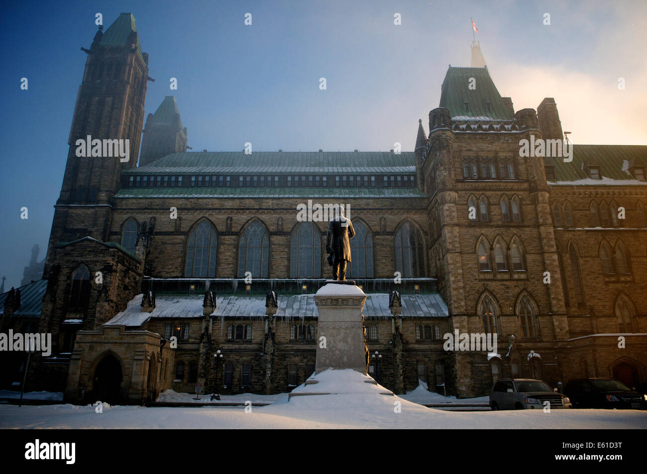 Statue of Alexander Mackenzie beside Canada's Parliament Buildings (House of Commons) one wintry morning. Stock Photo
