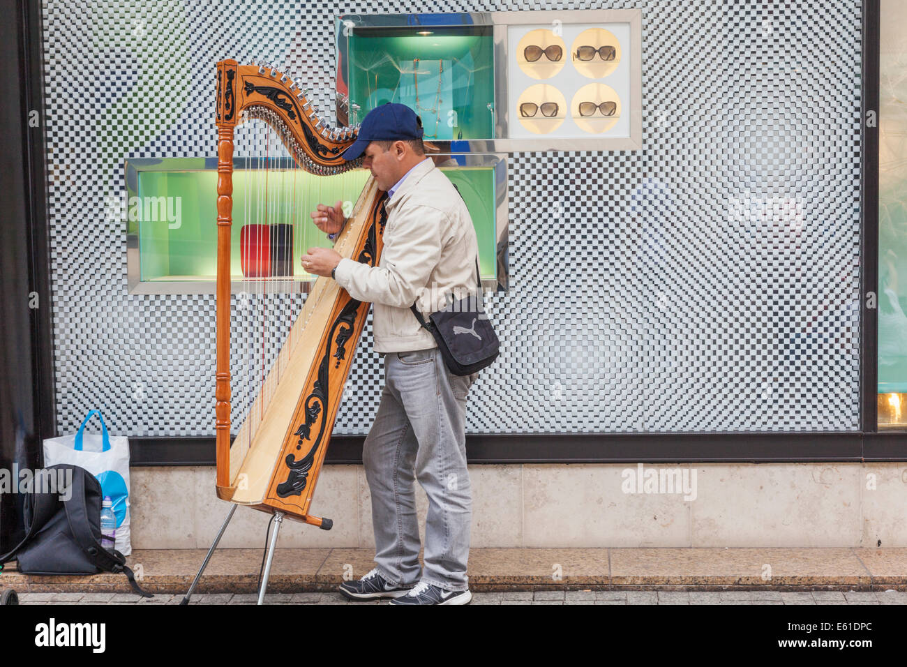 England, Manchester, Busker Playing Harp Stock Photo Alamy