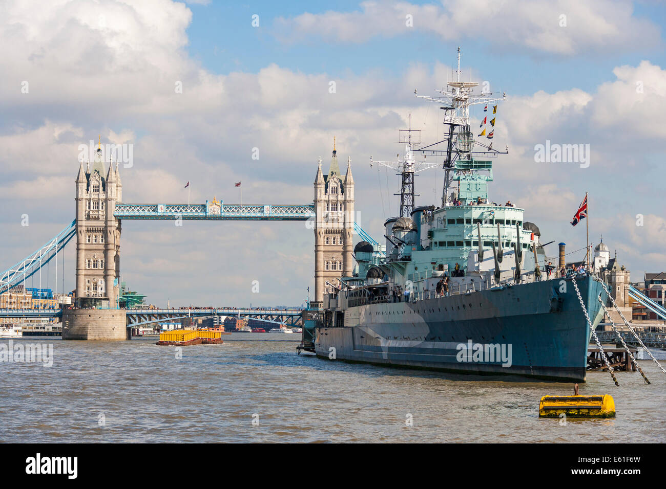 Tower Bridge and HMS Belfast warship on the River Thames London England UK viewed from a boat on the river. JMH6341 Stock Photo
