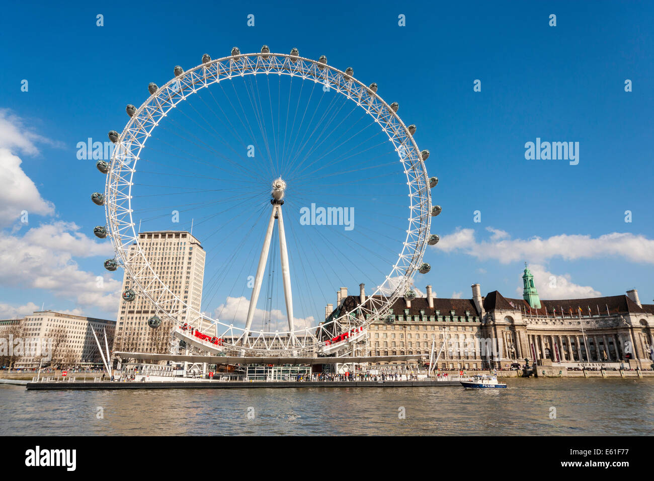 The London Eye or Millenium Wheel on the South Bank of the River Thames in London England UK viewed from the river. JMH6344 Stock Photo