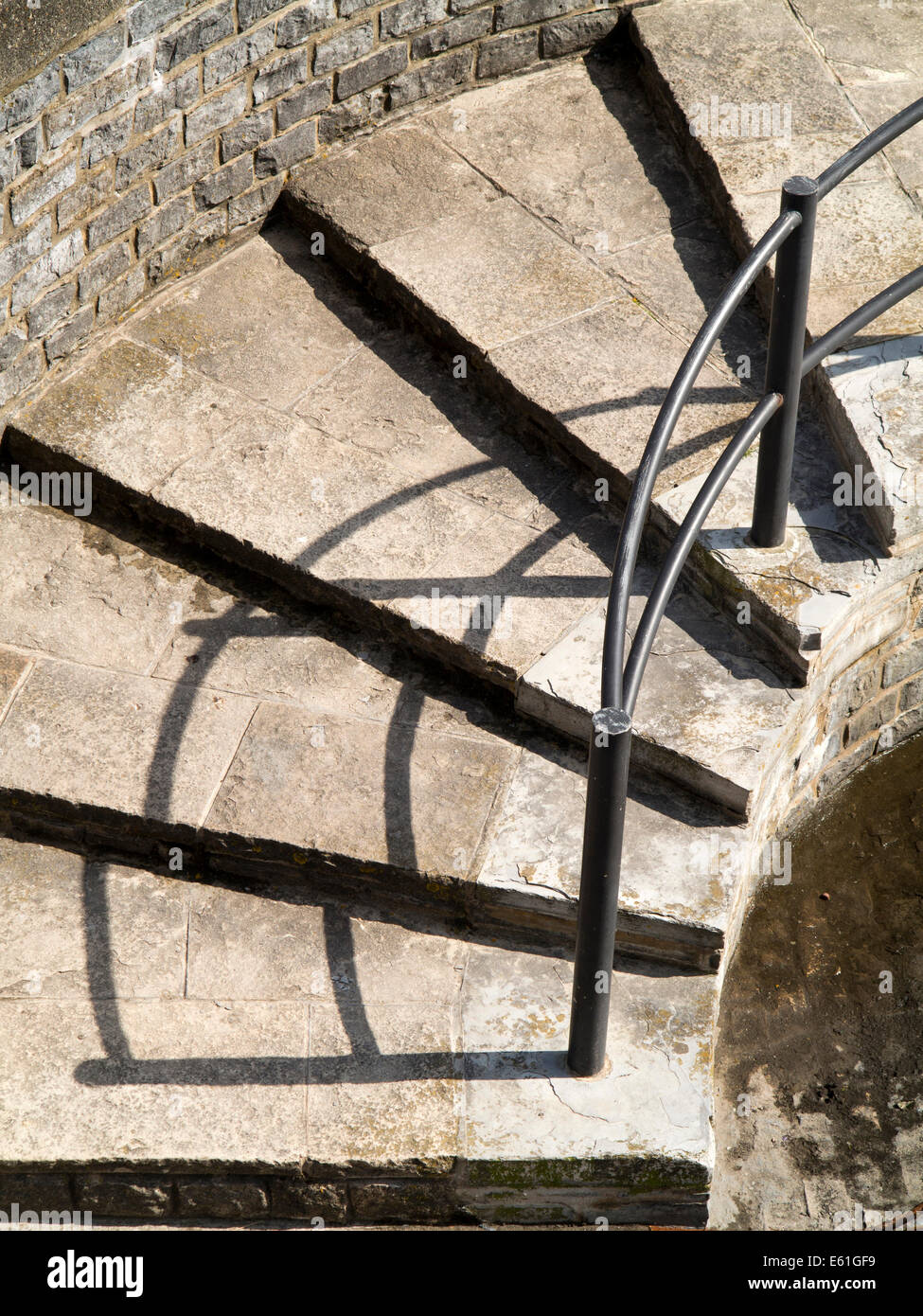UK England, Dorset, Lyme Regis. shadow of handrail up seafront defence steps Stock Photo