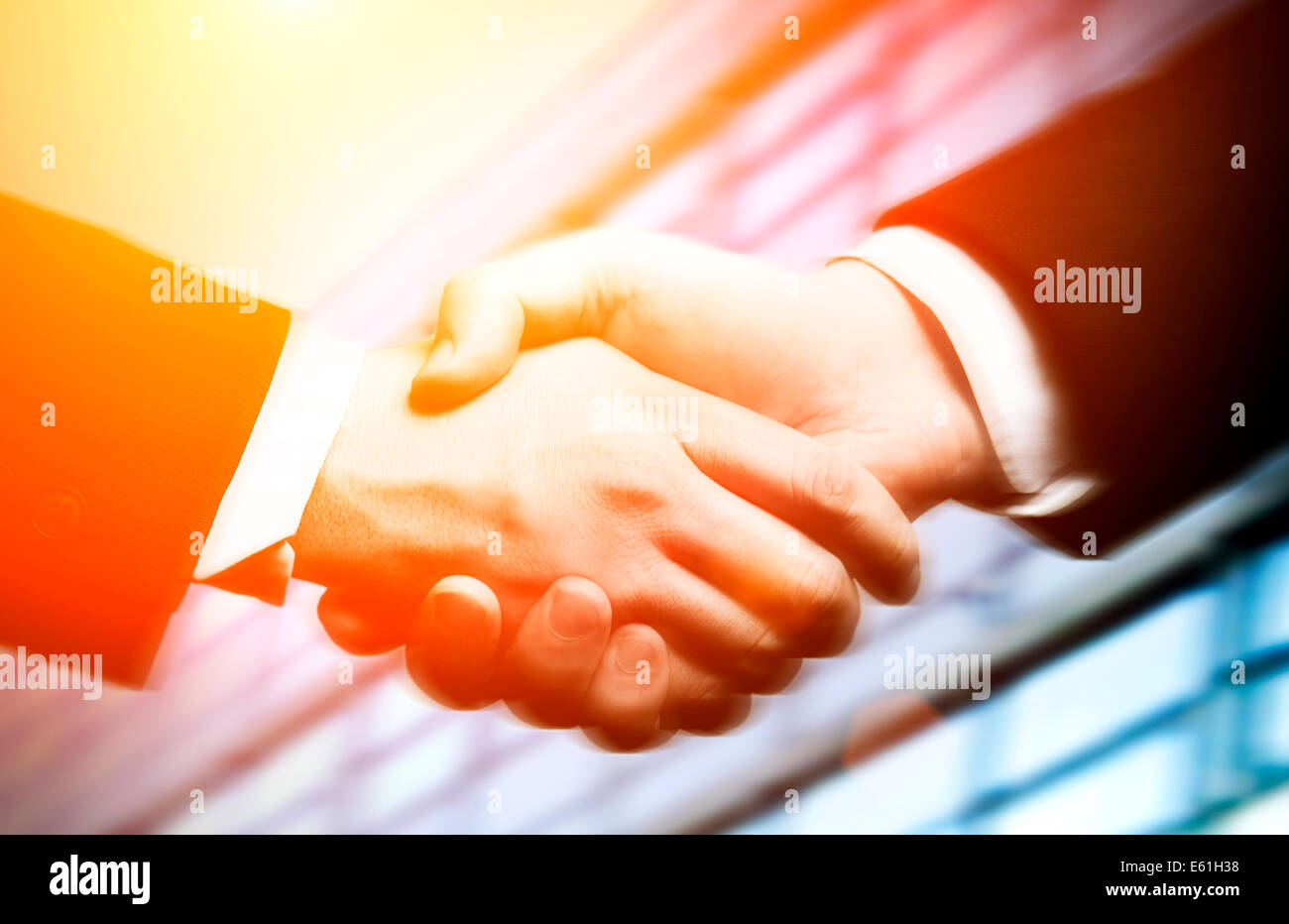 Hand shake with buildings hi-res stock photography and images - Alamy