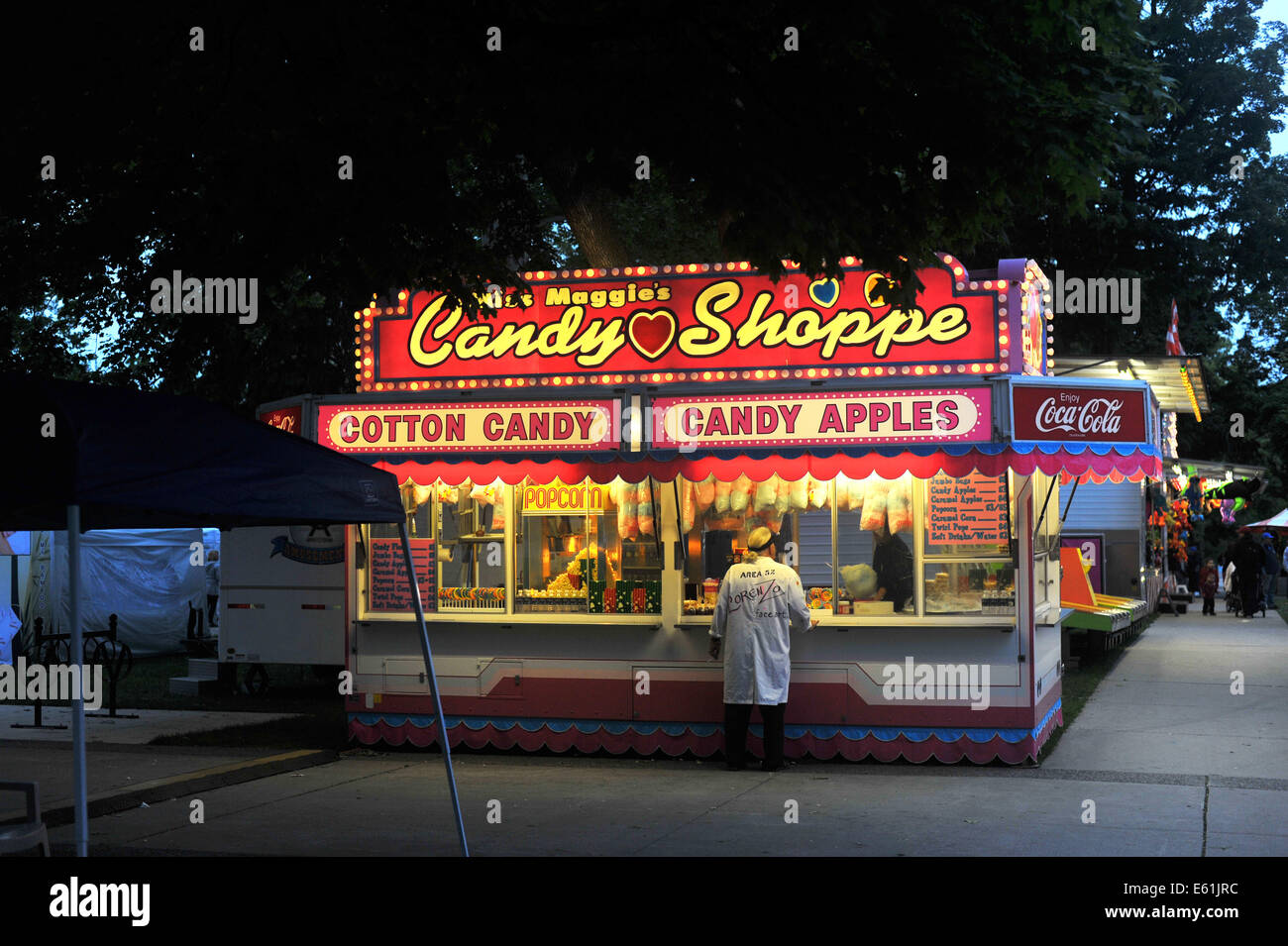 A candy food van at a funfair at night time Stock Photo Alamy