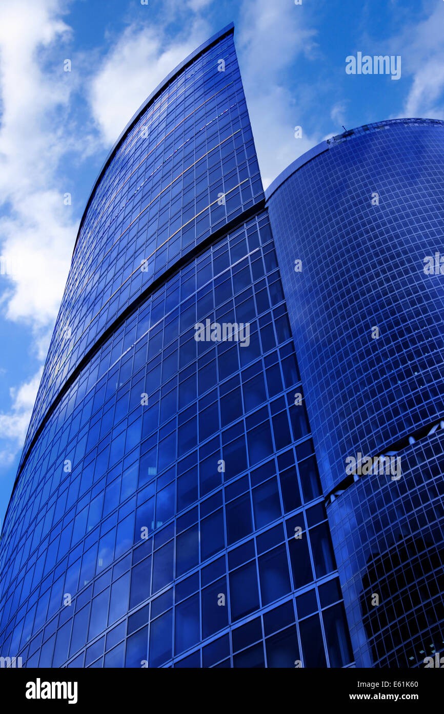 Modern skyscrapers close-up under blue sky with clouds Stock Photo - Alamy