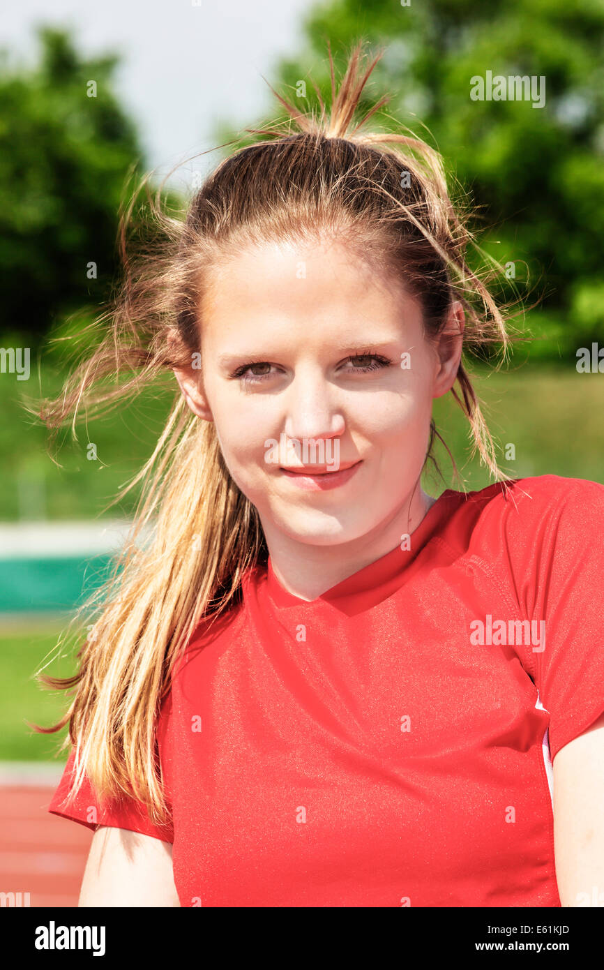 Portrait of a attractive young woman in a stadium Stock Photo