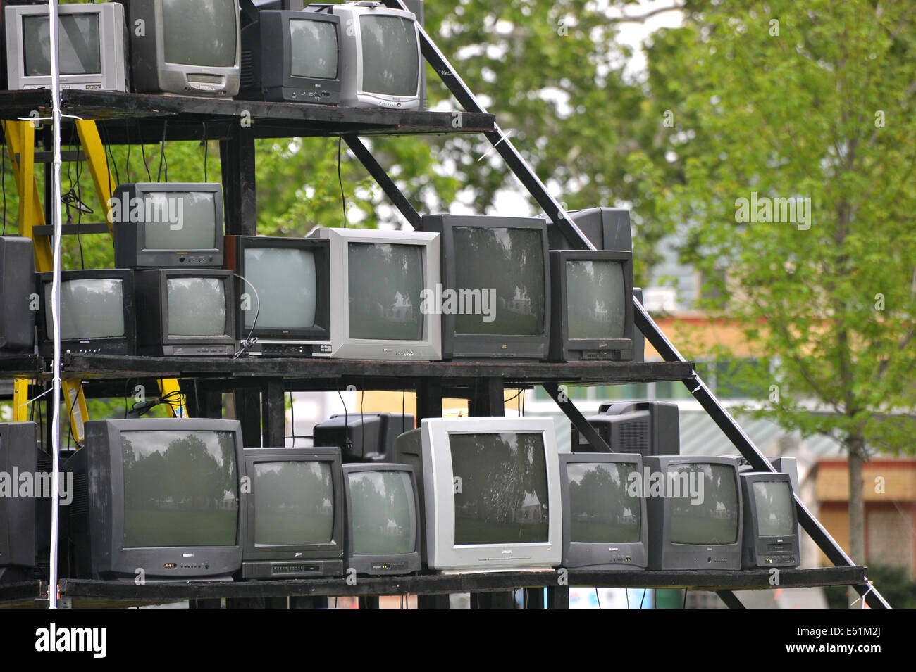 A pyramid of televisions in a park in London, Ontario. Stock Photo