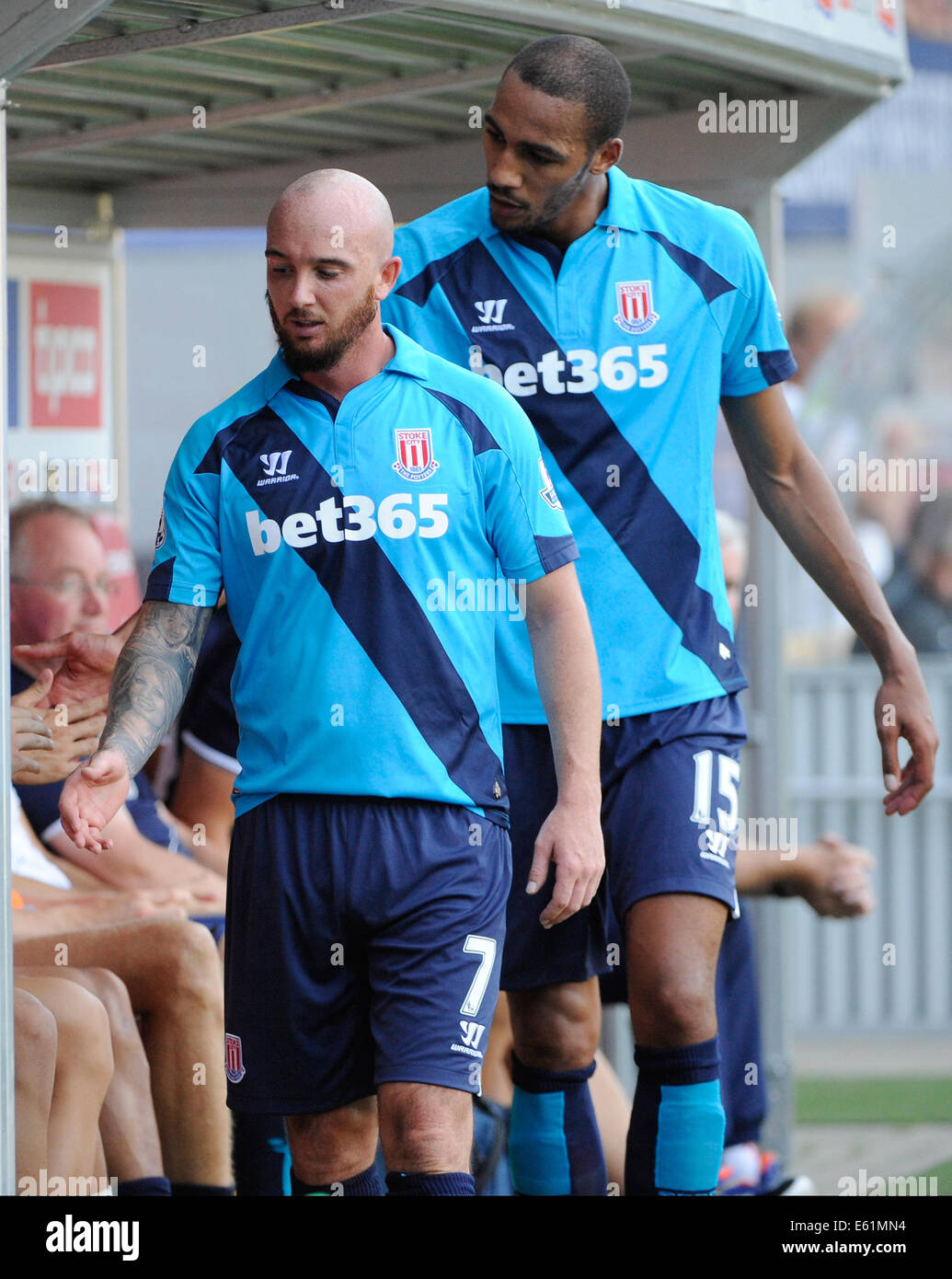Stoke's Stephen Ireland (L) and Steven N'Zonzi walk past the substitutes' bench during the soccer test match between SC Freiburg and Stoke City F.C. in Freiburg, Germany, 09 August 2014. Photo: Achim Keller/dpa Stock Photo