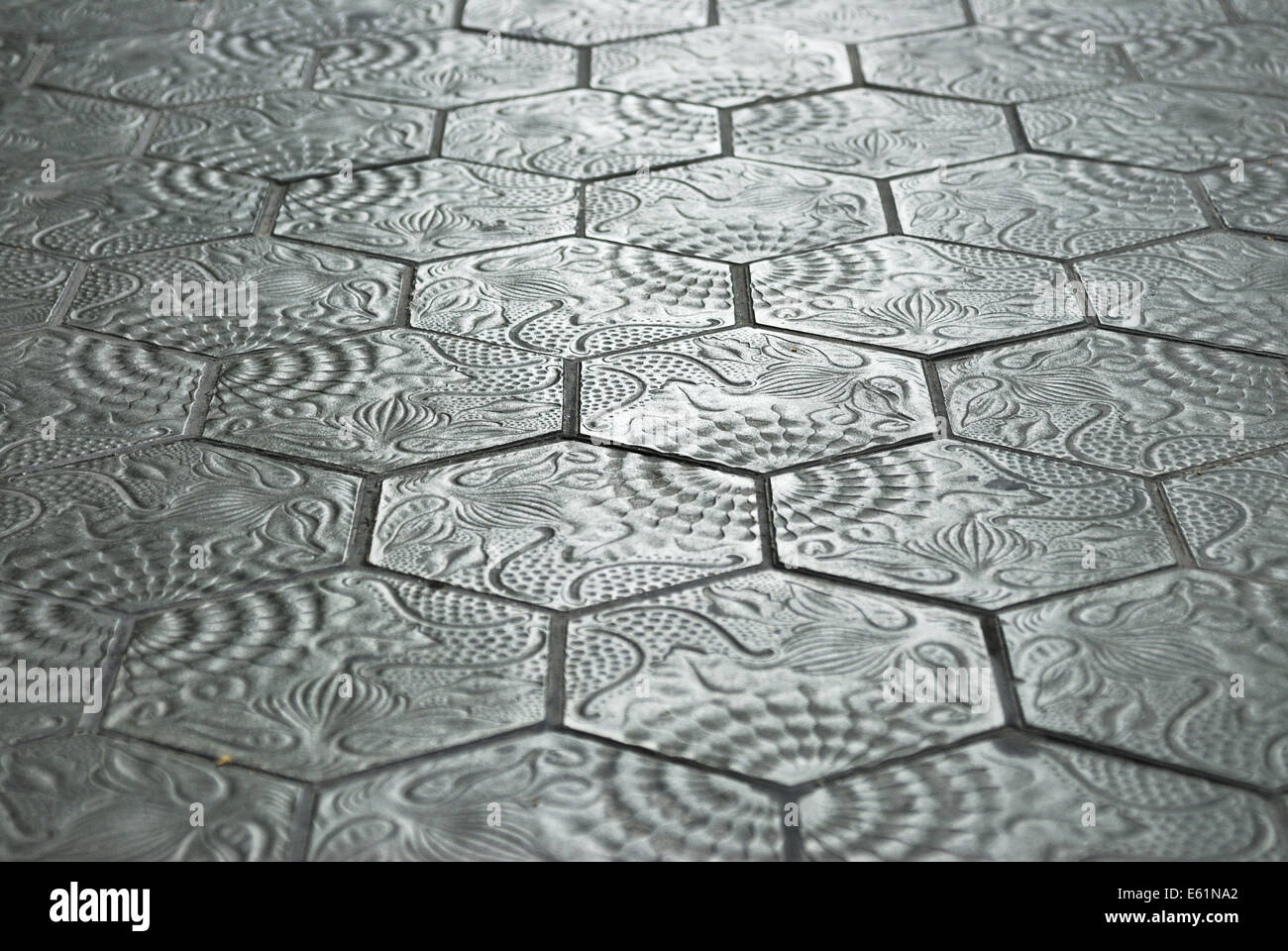 pavement made of hexagonal tiles with Gaudi motif decorations