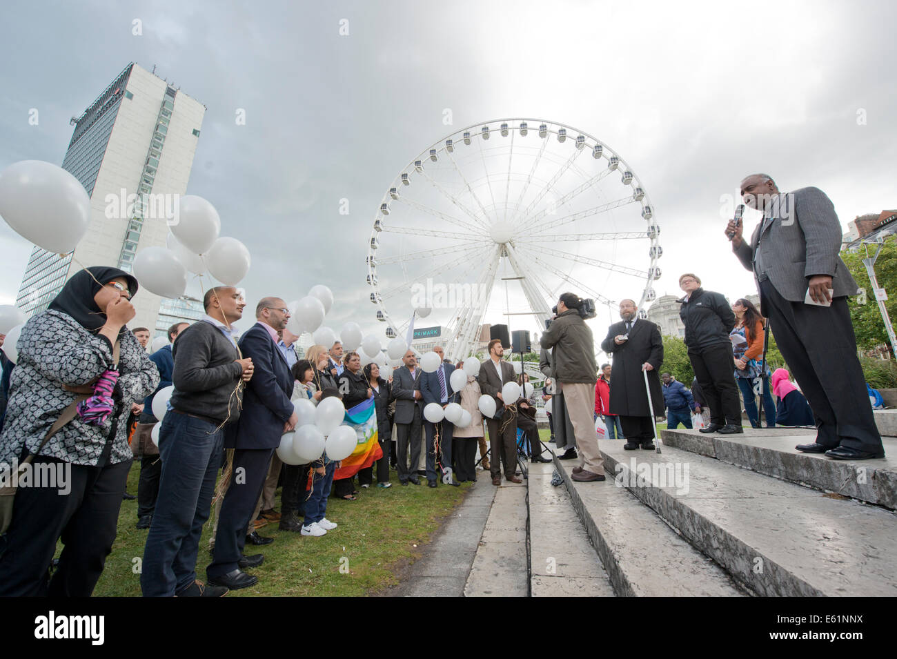 Manchester, UK. 11th August, 2014. A peace vigil is held in Piccadilly Gardens in Manchester in memory of those who have died in the Gaza conflict. Organised by Councillor Bev Craig, she is joined by a Dean, Rabbi and Imam in praying for peace – followed by the releasing of balloons Credit:  Russell Hart/Alamy Live News. Stock Photo