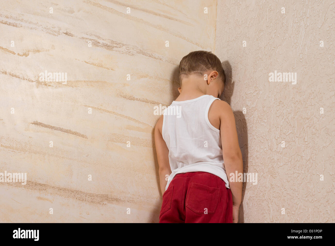 Little boy facing wall hires stock photography and images Alamy