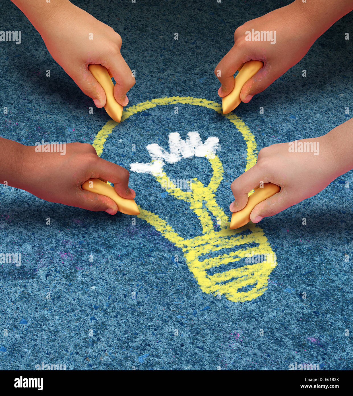Community ideas education concept as a group of children hands holding chalk drawing a lightbulb icon on a pavement floor as a s Stock Photo