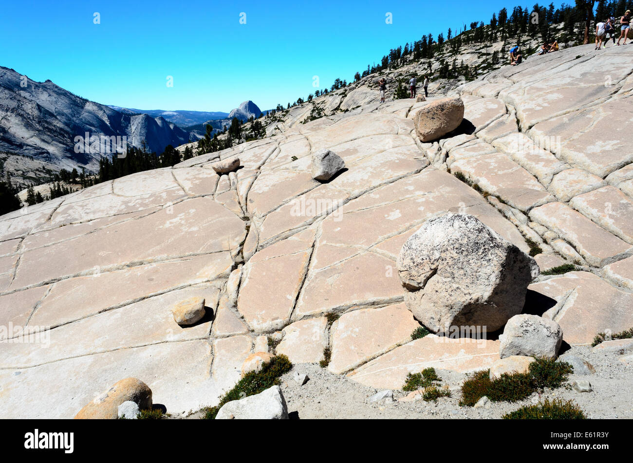 Tourists on the flat and cracked granite rocks, formed by glaciers, Olmsted Point, Yosemite NP Stock Photo