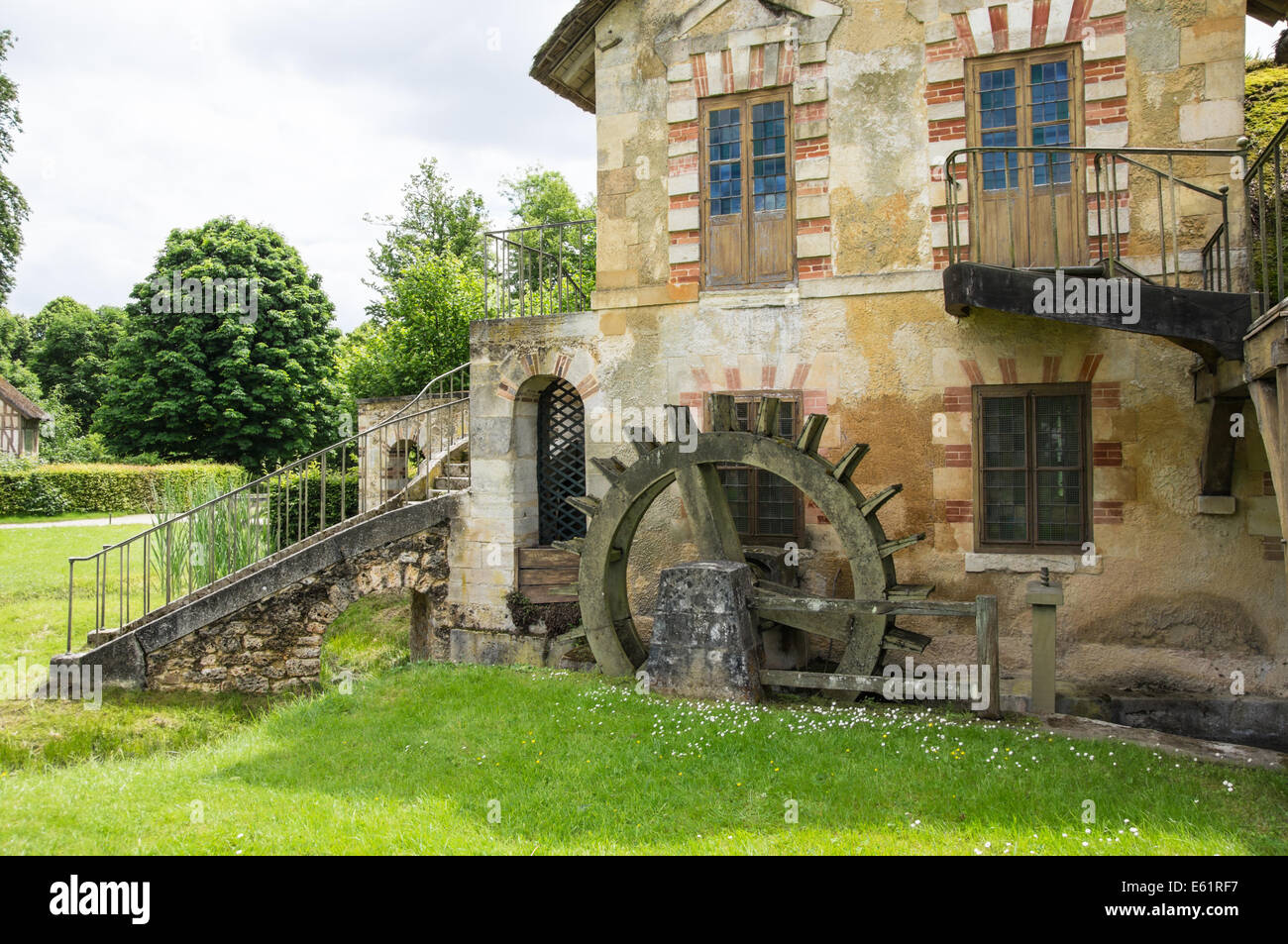 Old mill in the in the Queen's Hamlet (Marie-Antoinette's Estate) in Versailles, France Stock Photo