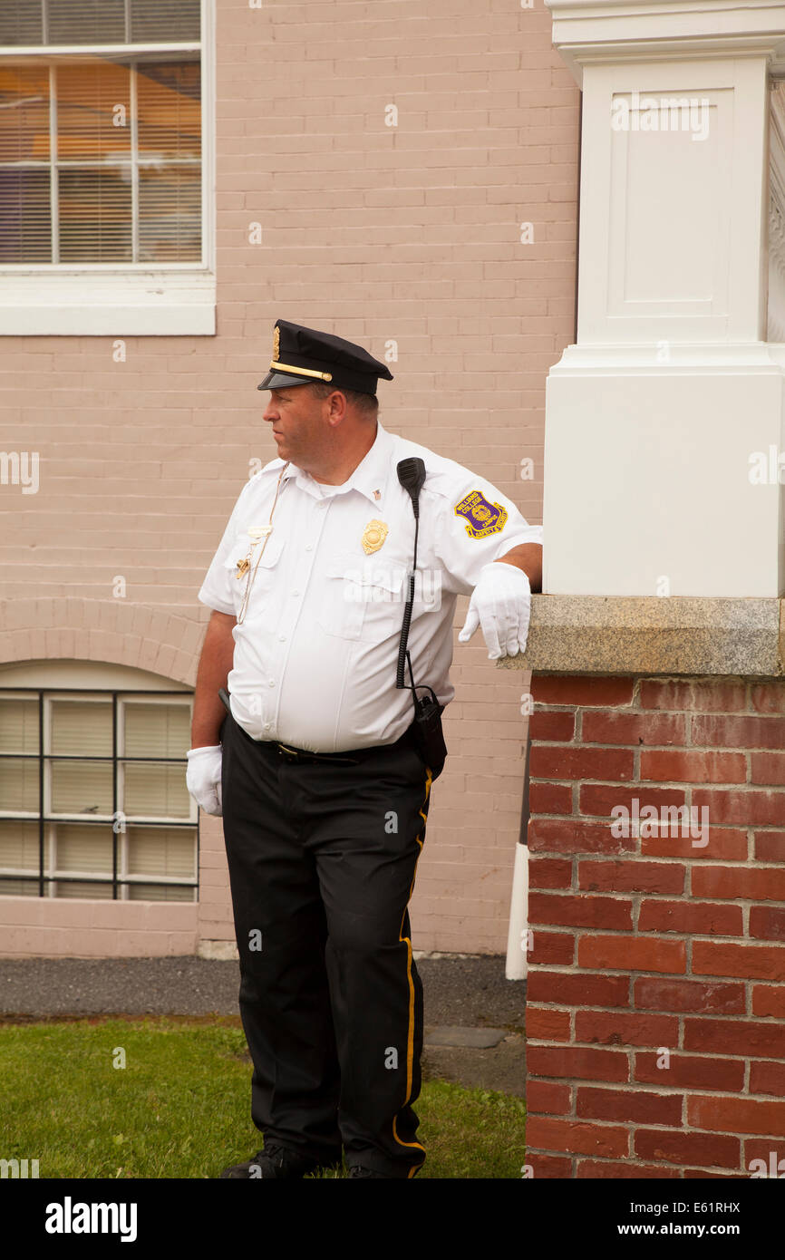Campus police officer awaits the start of graduation ceremony  at Williams College  in Williamstown, MA. Stock Photo
