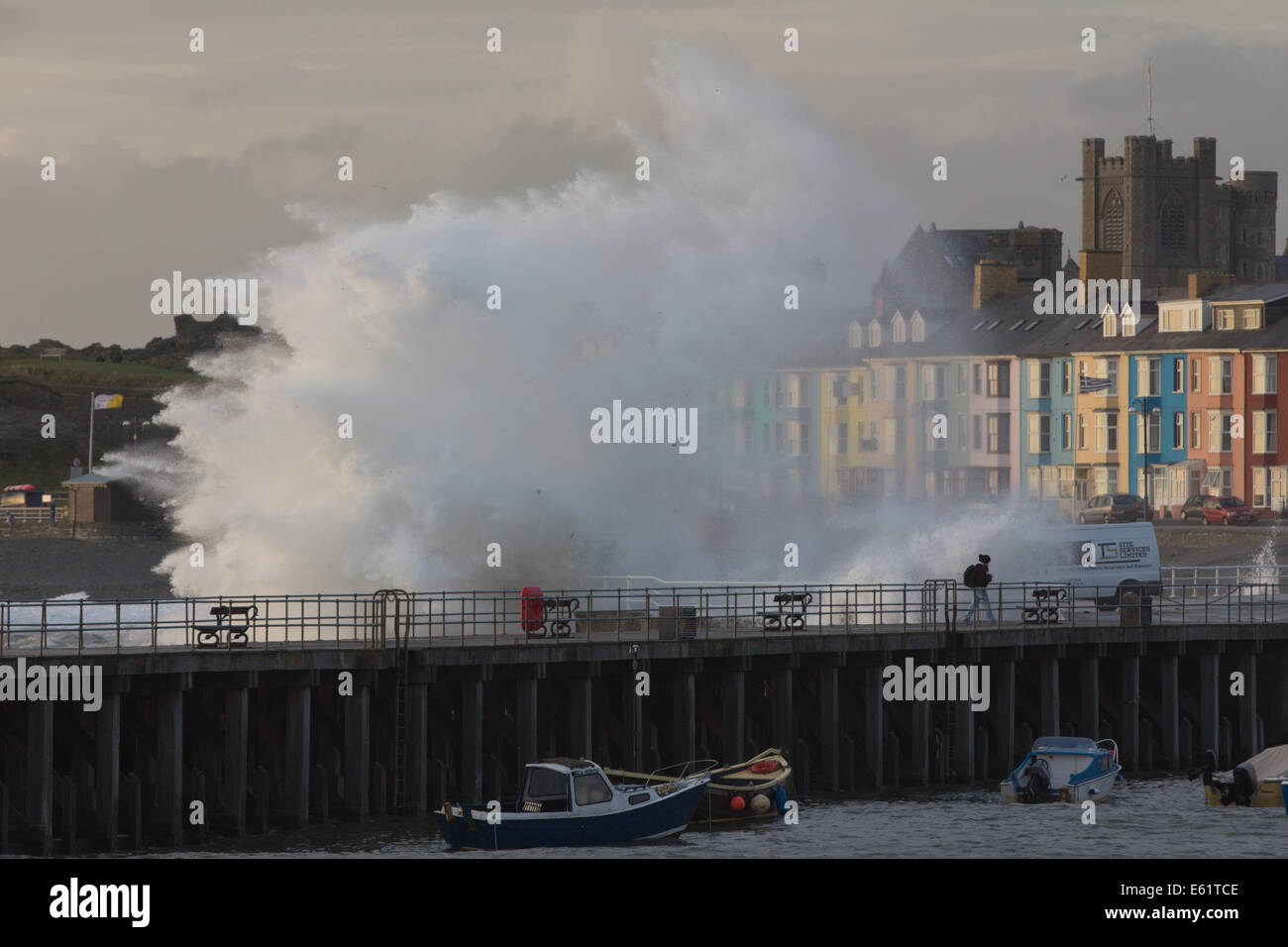 Aberystwyth, Wales, UK. 11th Aug, 2014. A big tide at dusk together with waves stirred-up by the tail-end of ex-hurricane Bertha are an unwelcome reminder of the devastating winter storms which hit the Ceredigion coast in January Credit:  atgof.co/Alamy Live News Stock Photo
