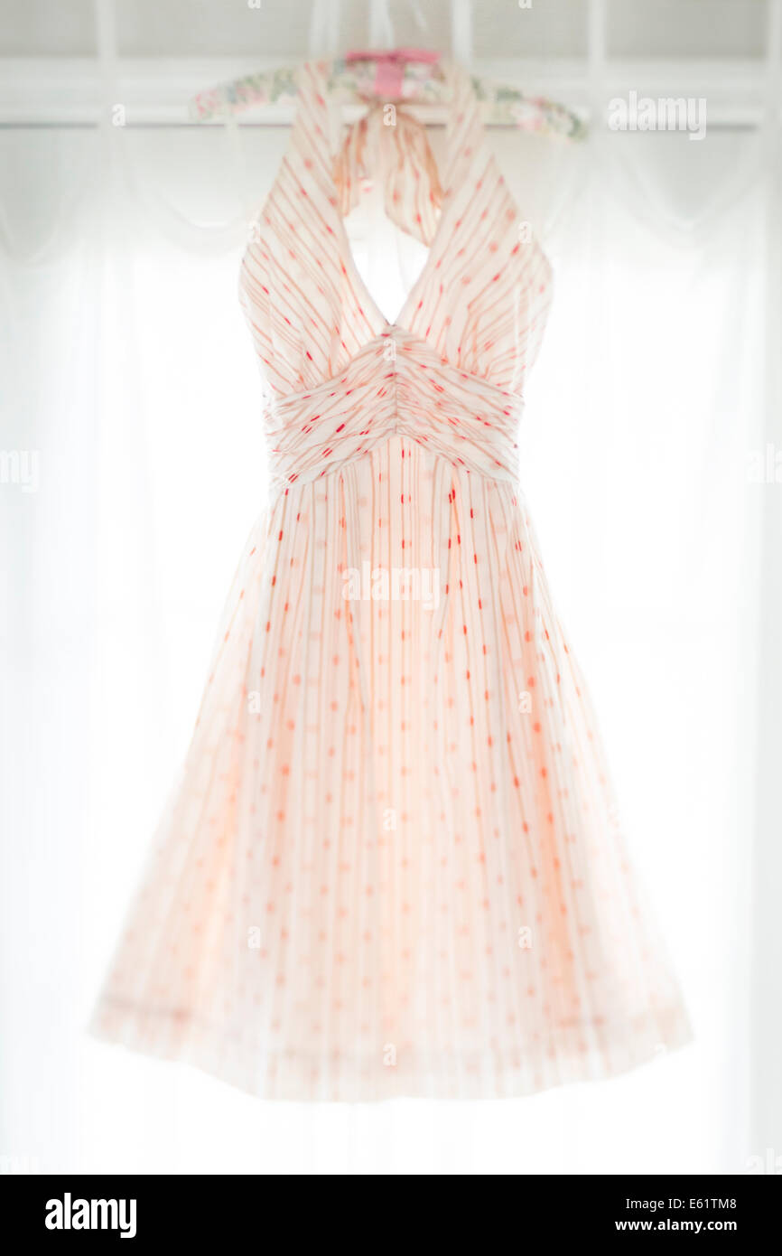 Dress hanging in closet Stock Photo