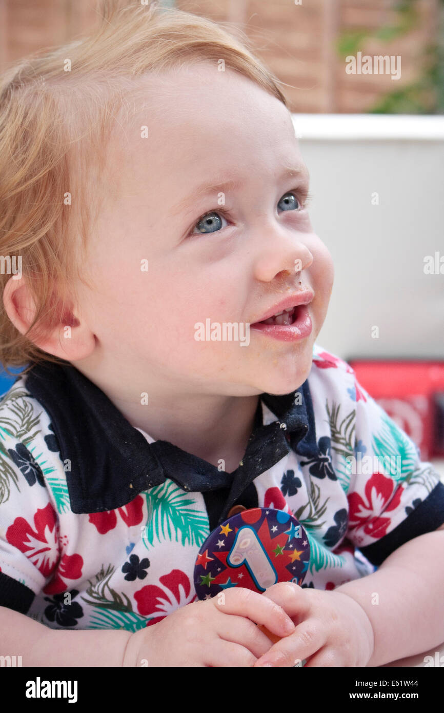 A one year old caucasian boy looking out of frame Stock Photo