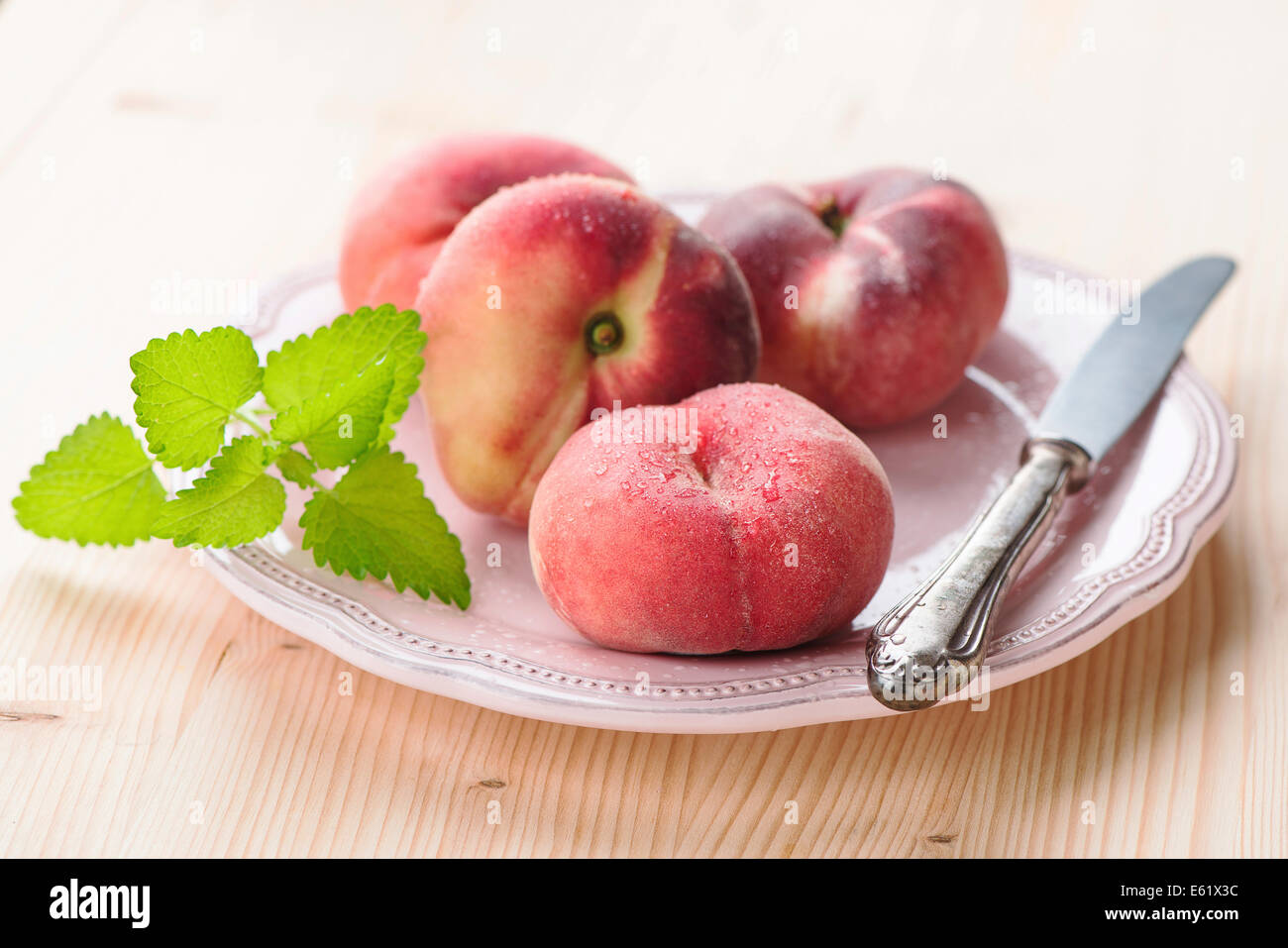Ripe juicy chinese flat peaches (also called Saturn peaches) Stock Photo