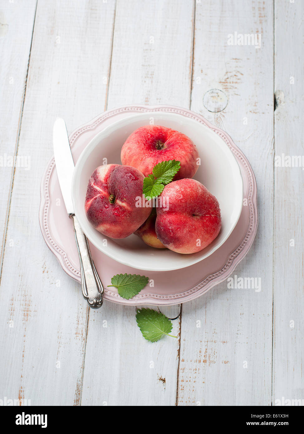 Ripe juicy chinese flat peaches (also called Saturn peaches) Stock Photo