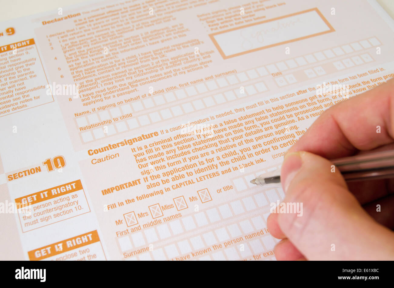 Completing a United Kingdom Passport Application Form Stock Photo