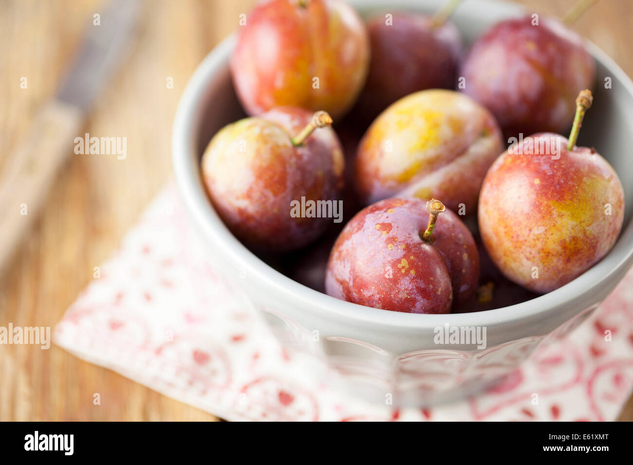 Opal Plums in Bowl Stock Photo