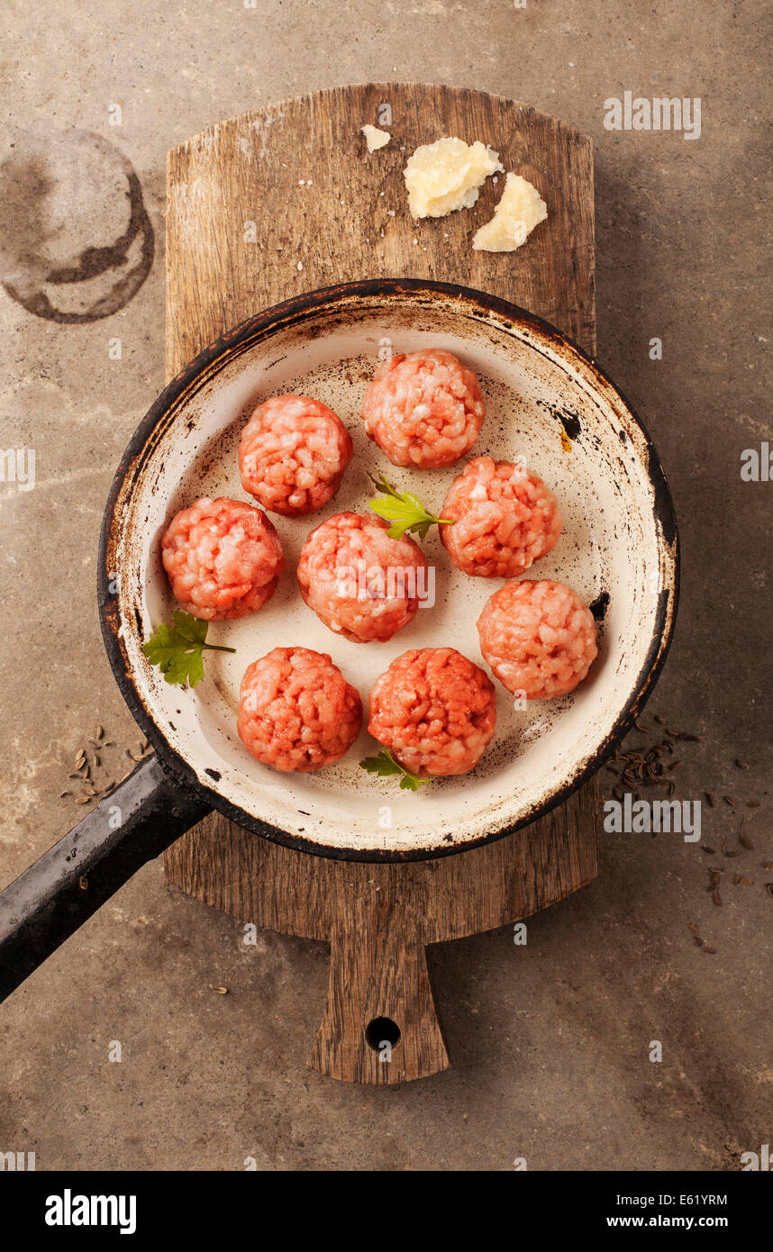 Meatballs cooking with mince, parsley, parmesan, wine and eggs Stock Photo Alamy