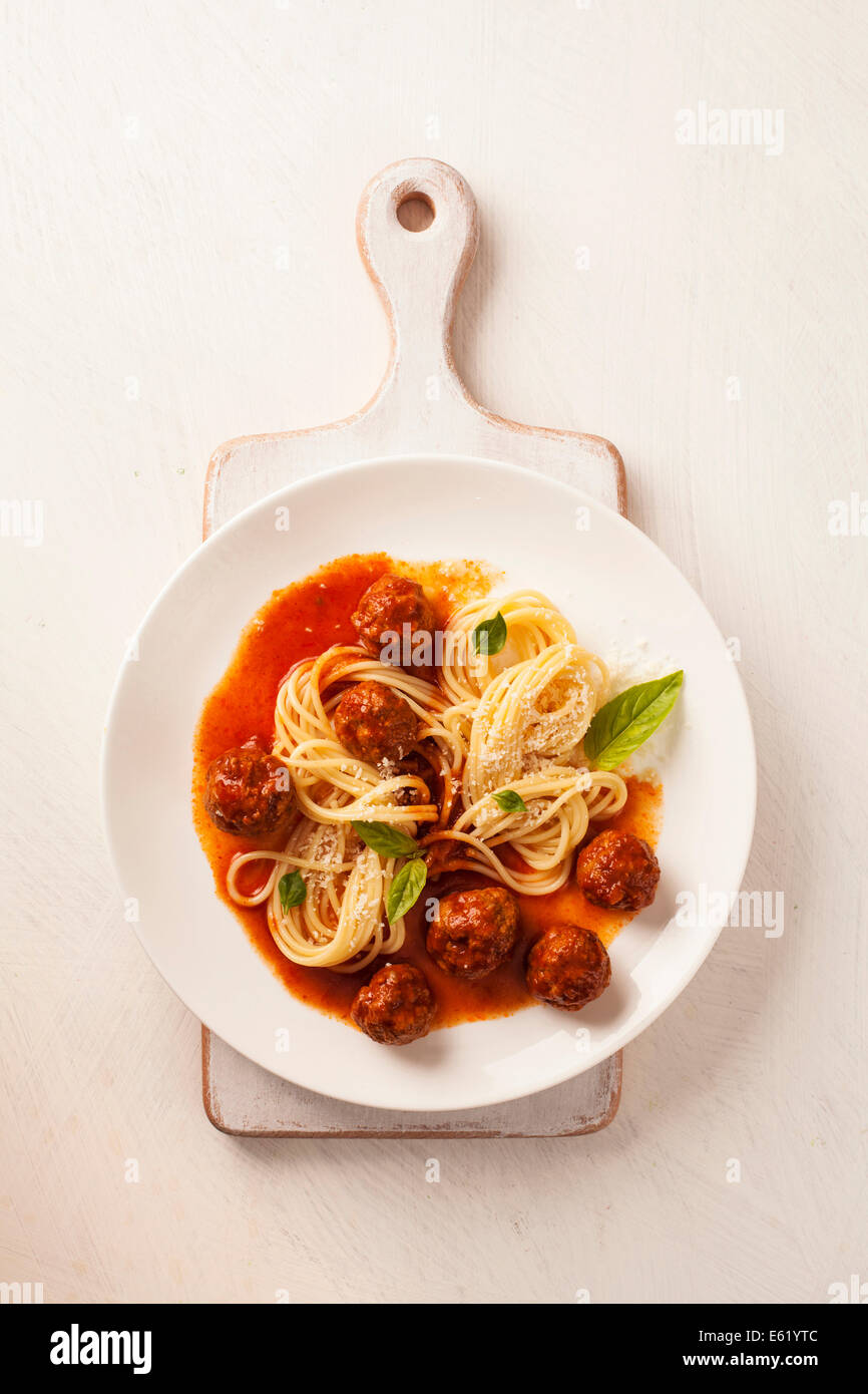 Spaghetti with meatballs with fresh basil and tomato sauce Stock Photo