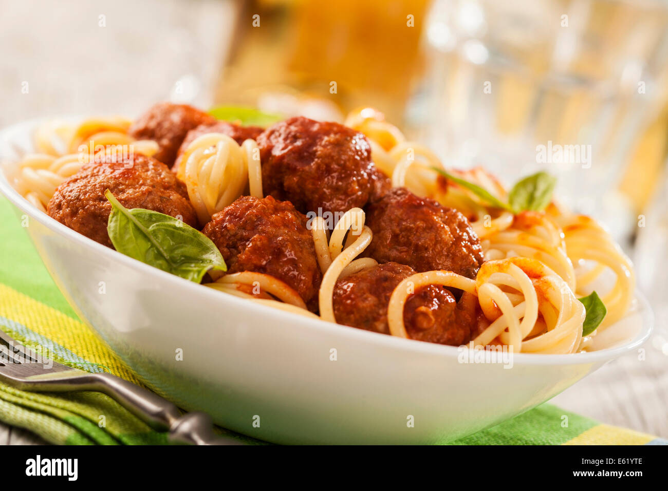 Pasta with meatballs with fresh basil and tomato sauce Stock Photo