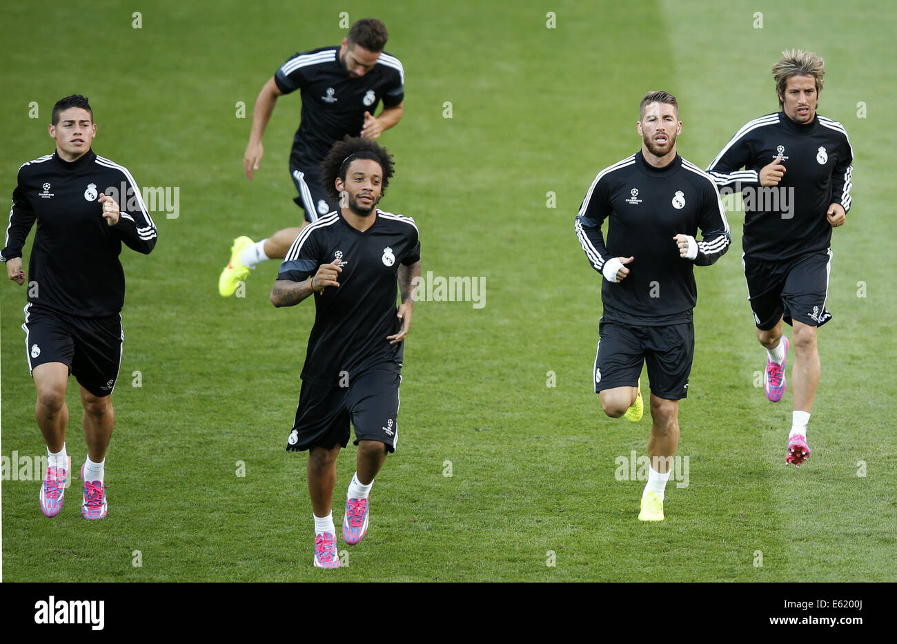 Cardiff, L to R) of Real Madrid take a training session for the UEFA Super Cup match between Real Madrid and Sevilla at Cardiff City Stadium in Cardiff. 11th Aug, 2014. James Rodriguez, Marcelo, Ramos and Fabio Coentrao (front, from L to R) of Real Madrid take a training session for the UEFA Super Cup match between Real Madrid and Sevilla at Cardiff City Stadium in Cardiff, Britain on Aug. 11, 2014. © Wang Lili/Xinhua/Alamy Live News Stock Photo