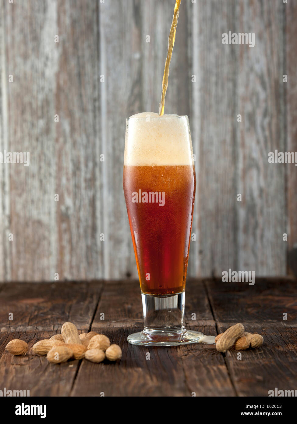 Pouring beer. Stock Photo