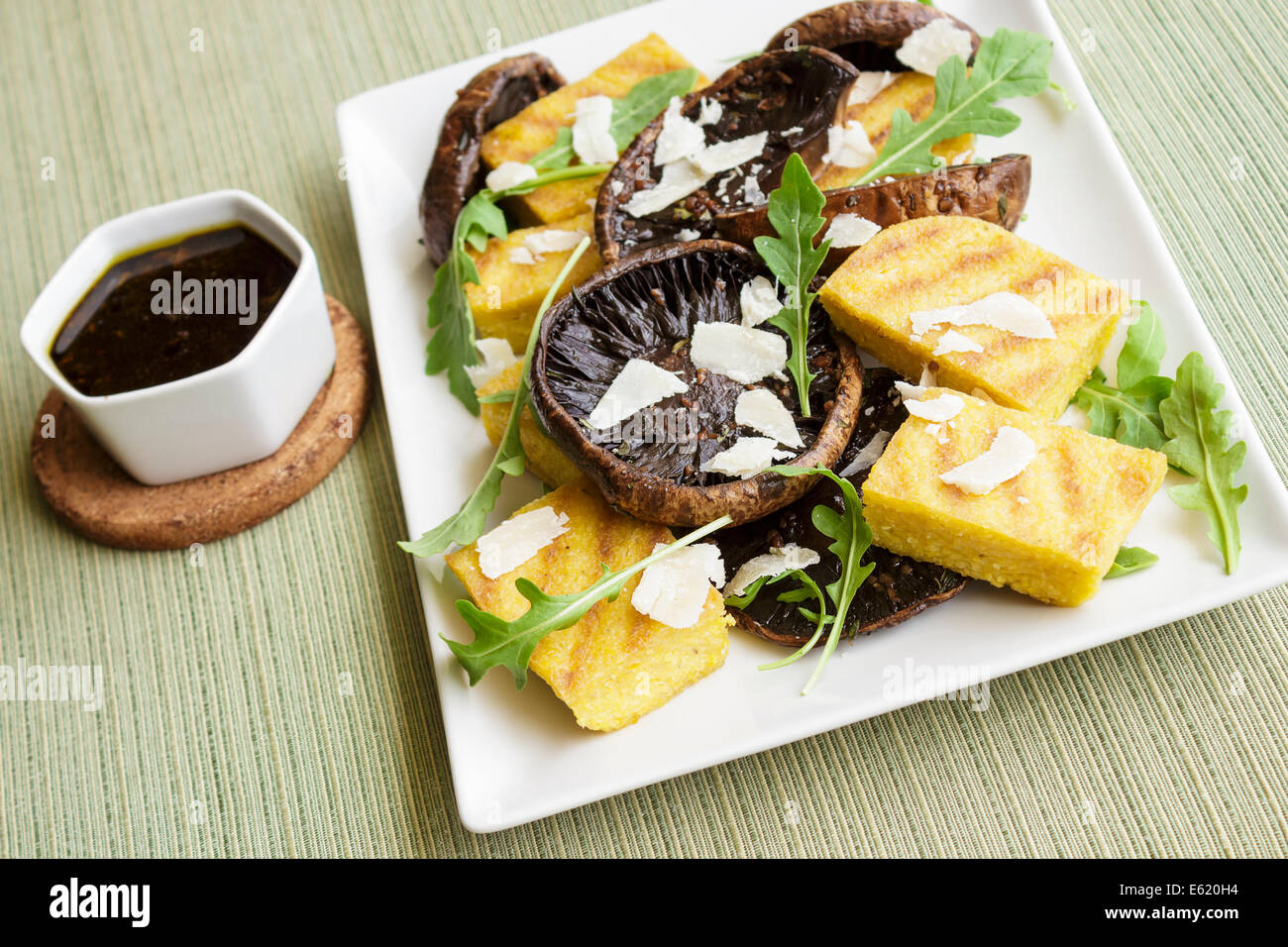 Balsamic marinated portobello mushrooms with grilled slices of polenta
