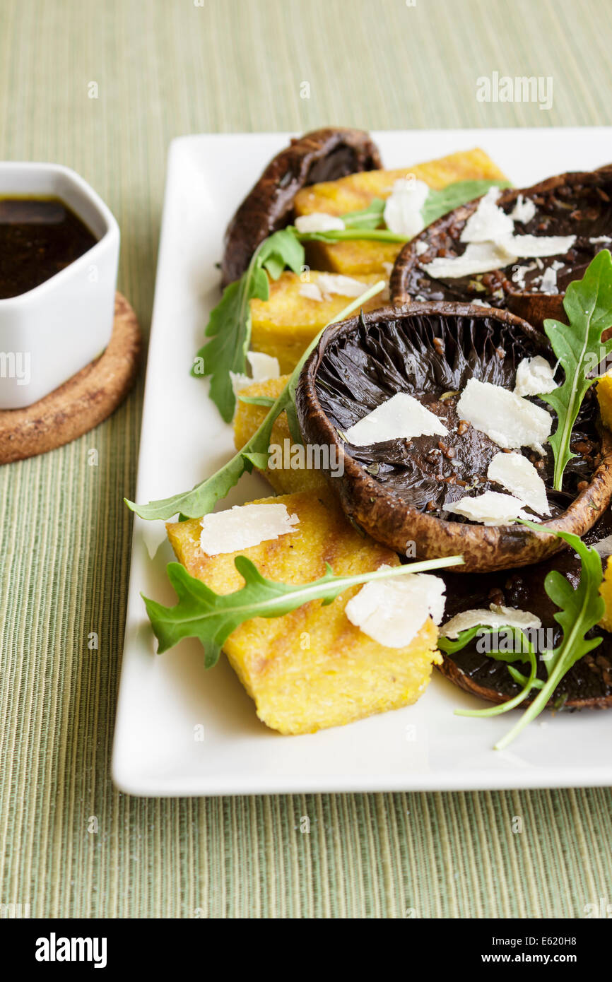 Balsamic marinated portobello mushrooms with grilled slices of polenta