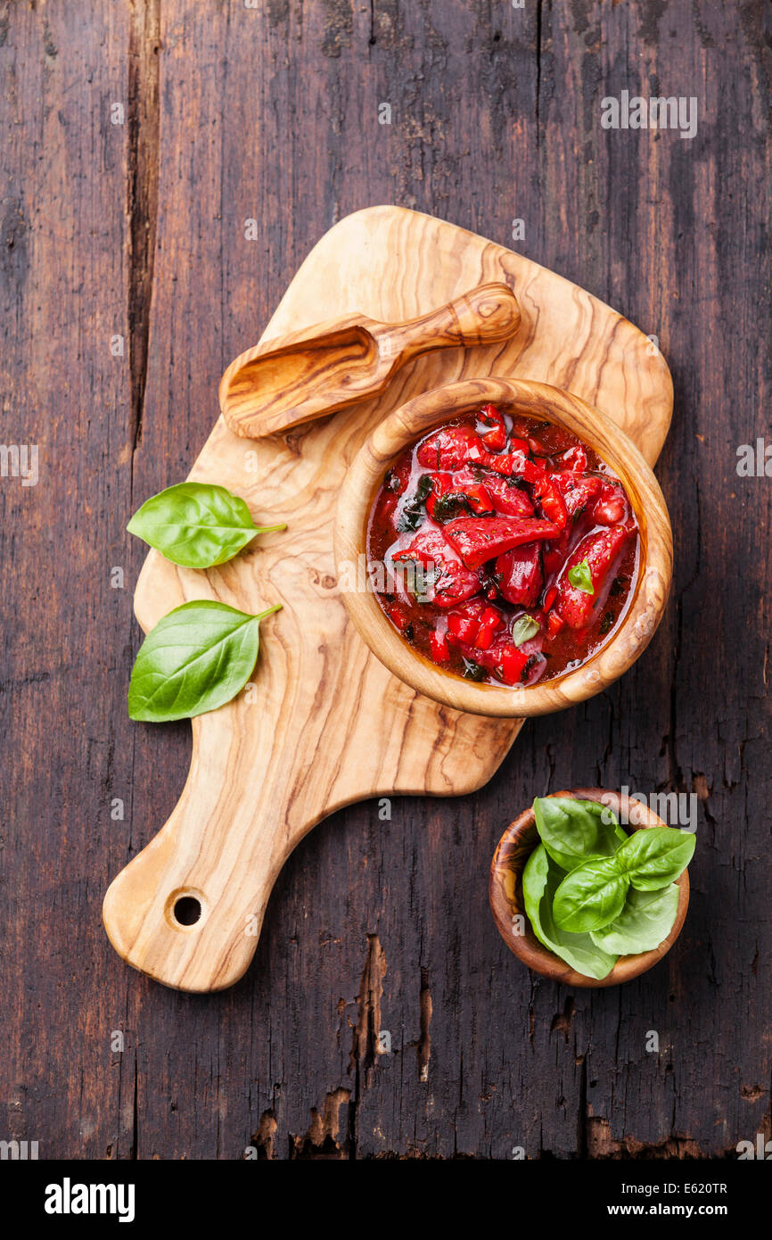 Strawberry salsa in wooden bowl on dark wooden background Stock Photo