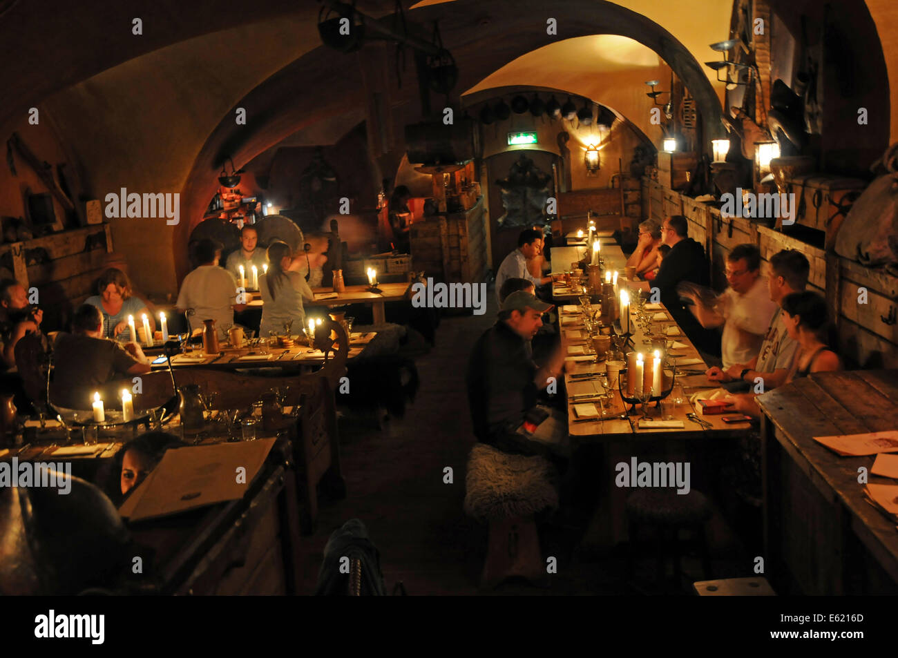 People at indoor restaurant built underground in a cave in the Old Town called Gamla Stan in Stockholm Stock Photo