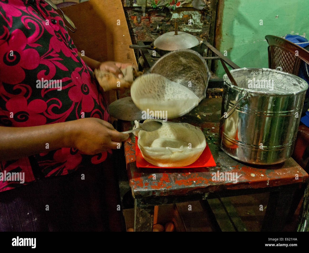 Woman cooking traditional appa pancakes in Sri Lanka Stock Photo - Alamy