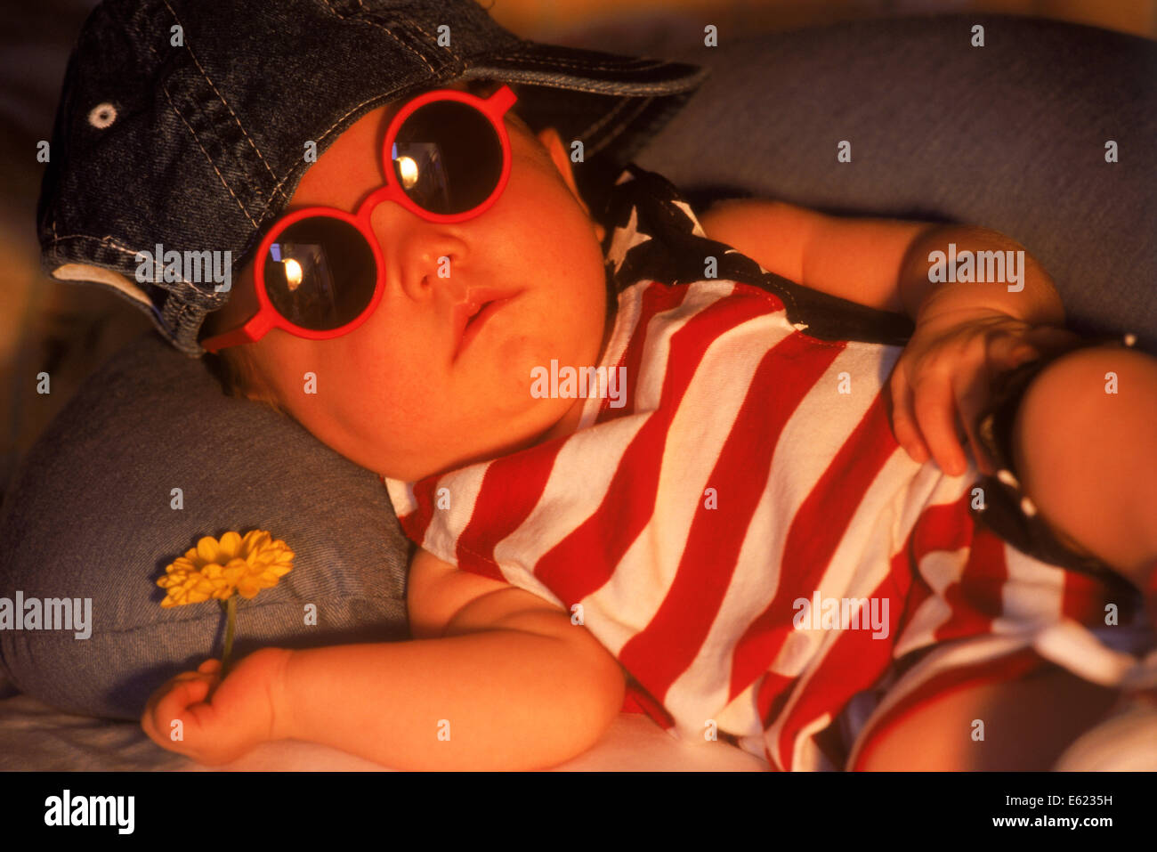 Baby sleeping in outfit that says made in America Stock Photo